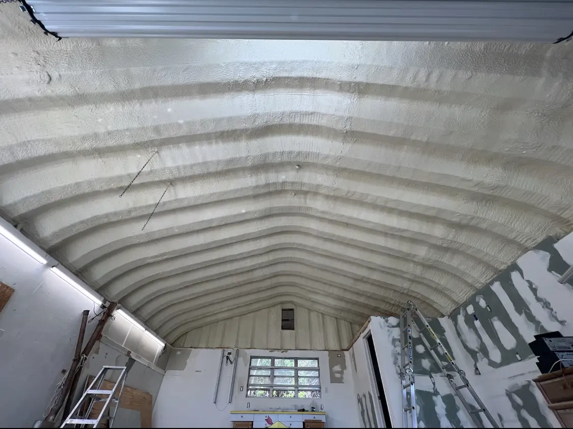 Spray polyurethane foam applied to the underside of a metal roof deck in Todd Creek